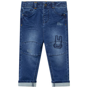 Vaquero efecto usado con bordados contrastados  