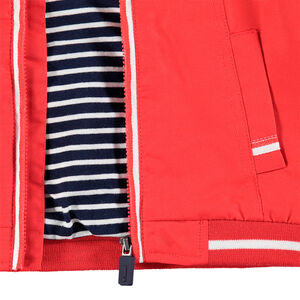 Cortavientos liso con forro de punto a rayas y bolsillos 