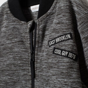 Gilet en polaire chinée à zip et message printé au dos 