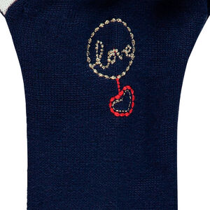 Chaqueta de punto con dibujo de jacquard y toques dorados. 