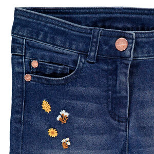 Vaquero slim efecto usado con bordados florales  
