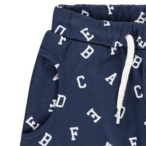 Pantalón de chándal de felpa con forma de sarouel y letras all-over 
