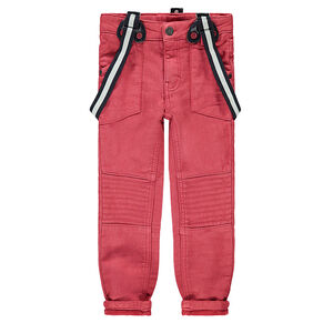 Pantalón de tela roja con efecto desgastado y tirantes desmontables elásticos 
