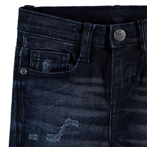 Jeans effet used et crinkle avec déchirures fantaisie 