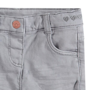 Pantalón slim de algodón teñido con efecto crinkle con corazones bordados en la cintura 