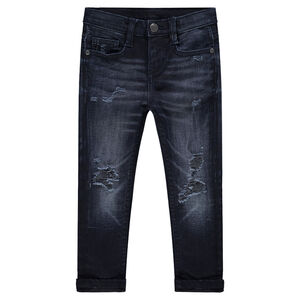 Jeans effet used et crinkle avec déchirures fantaisie 