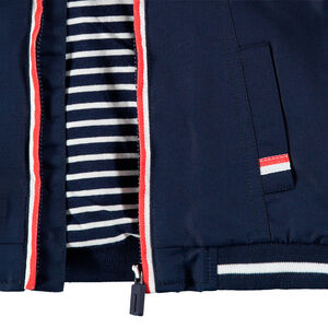 Cortavientos liso con forro de punto a rayas y bolsillos 