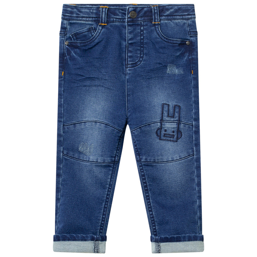 Vaquero efecto usado con bordados contrastados  