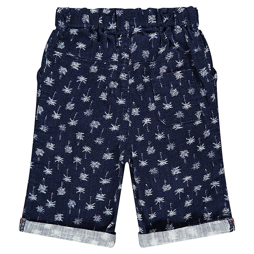 Bermudas de tela con palmeras estampadas all over. 