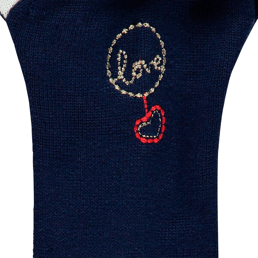Chaqueta de punto con dibujo de jacquard y toques dorados. 