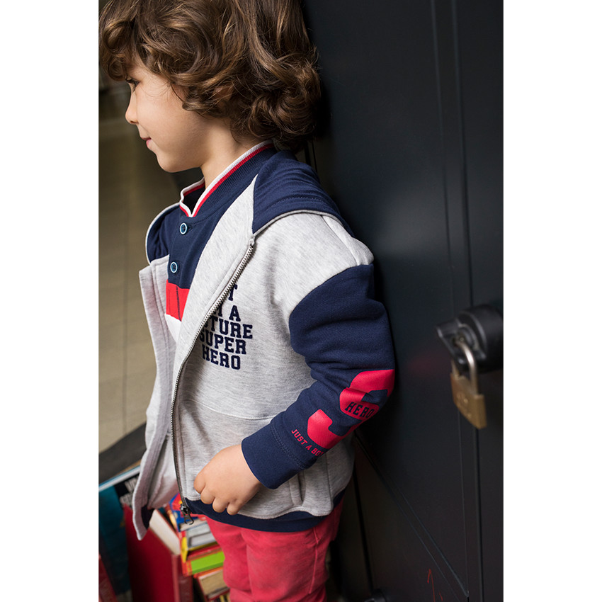 Polo de manga larga de algodón cosido con bandas que contrastan y bolsillo 