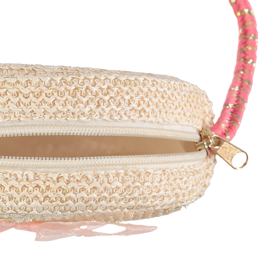 bolso de paja redondo con bandolera rosa y dorada 