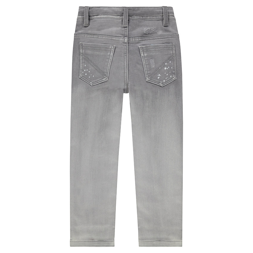 Vaqueros con efecto desgastado con manchas y parches cosidos 